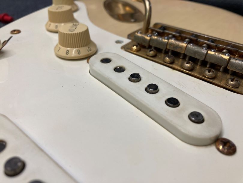 The pickups have magnets set to different pitches to give a balanced sound