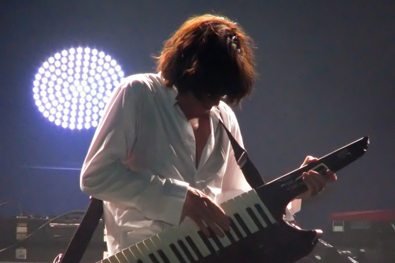  Jean Michel Jarre playing an AX-Synth | Photo: Zero Coool, Flickr (CC BY 2.0) 