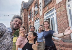 Loes and Honza at Casino van Gompel with the people who are currently helping to renovate it: Sophie (USA), Jesus (MX), Virginia (AR) and Candela (AR) | Photo: Honza Bartošek