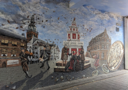 Mural in the Kerkegasje from the series “Waalpaintings” about the Treaty of Nijmegen (1672-79). Artists: RoosArt and Combolution | Photo: Honza Bartošek