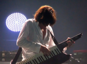  Jean Michel Jarre playing an AX-Synth | Photo: Zero Coool, Flickr (CC BY 2.0) 