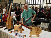 Mike Sankey with his work at the fair. | Photo: Sankey Guitars Facebook