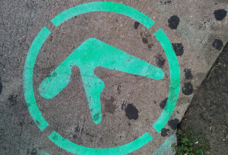 Aphex Twin's logo as street art on a sidewalk in New York City | Photo by Autopilot (CC by 4.0)