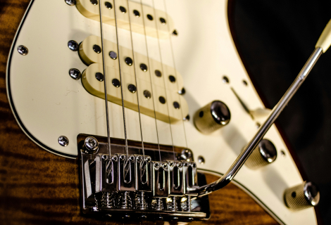 The guitar pickup is the "magical" place where the vibrations of the strings are transformed into an electrical signal, which is then sent to your amp: Dominik Scythe on Unsplash